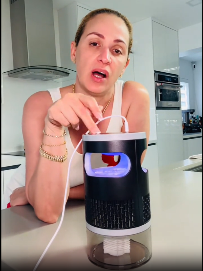 Customer using the insect trap in a kitchen