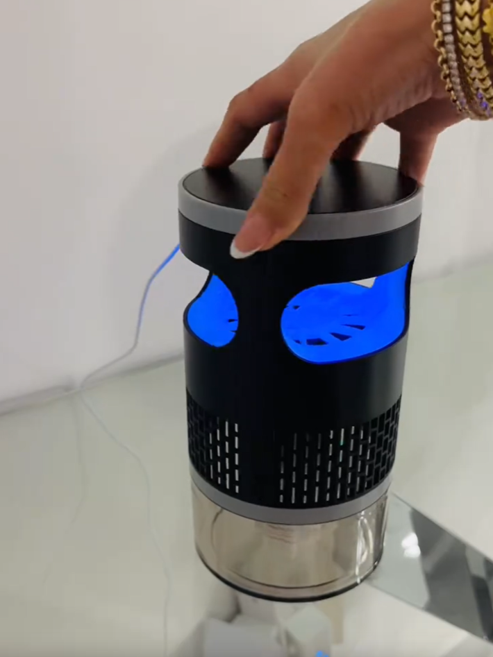 Customer handling the insect trap